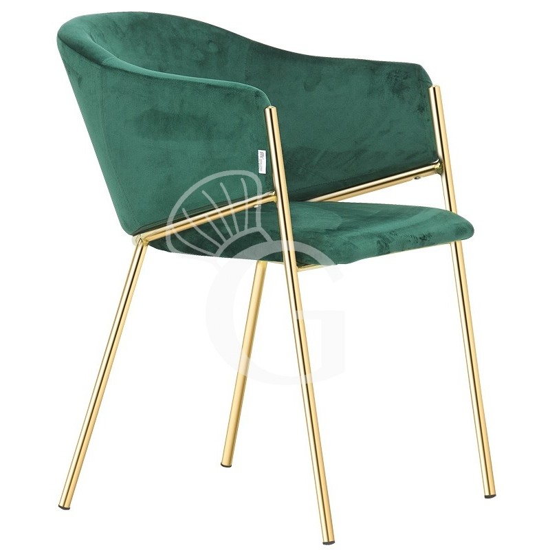 Silla con estructura de metal acabado latón y tapizado en tejido o terciopelo